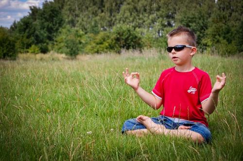 little boy practicing mindfulness