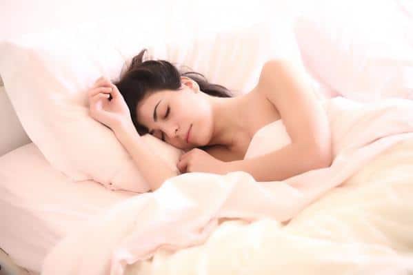 sleeping woman restorative yoga benefits
