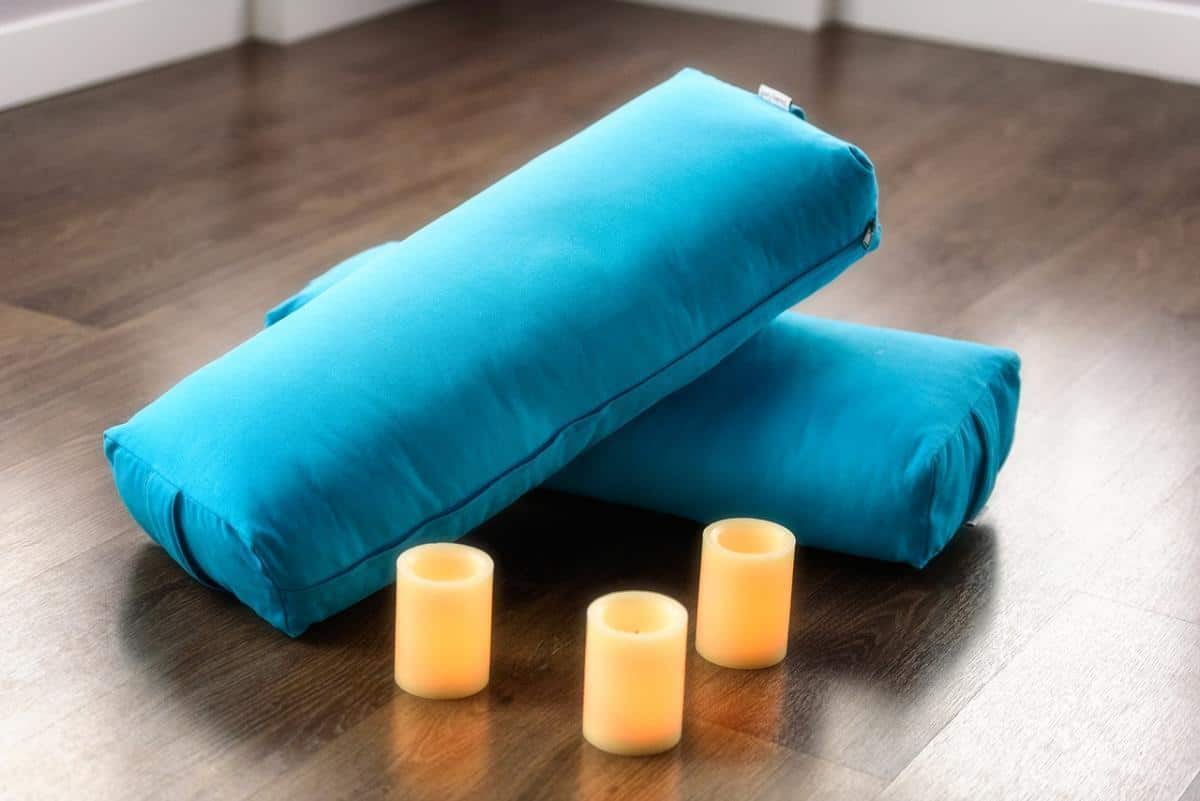 restorative yoga uses bolsters and pillows for support